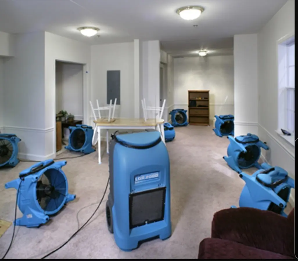 Air movers and dehumidifier setup for Water Damage Restoration in Iowa Colony